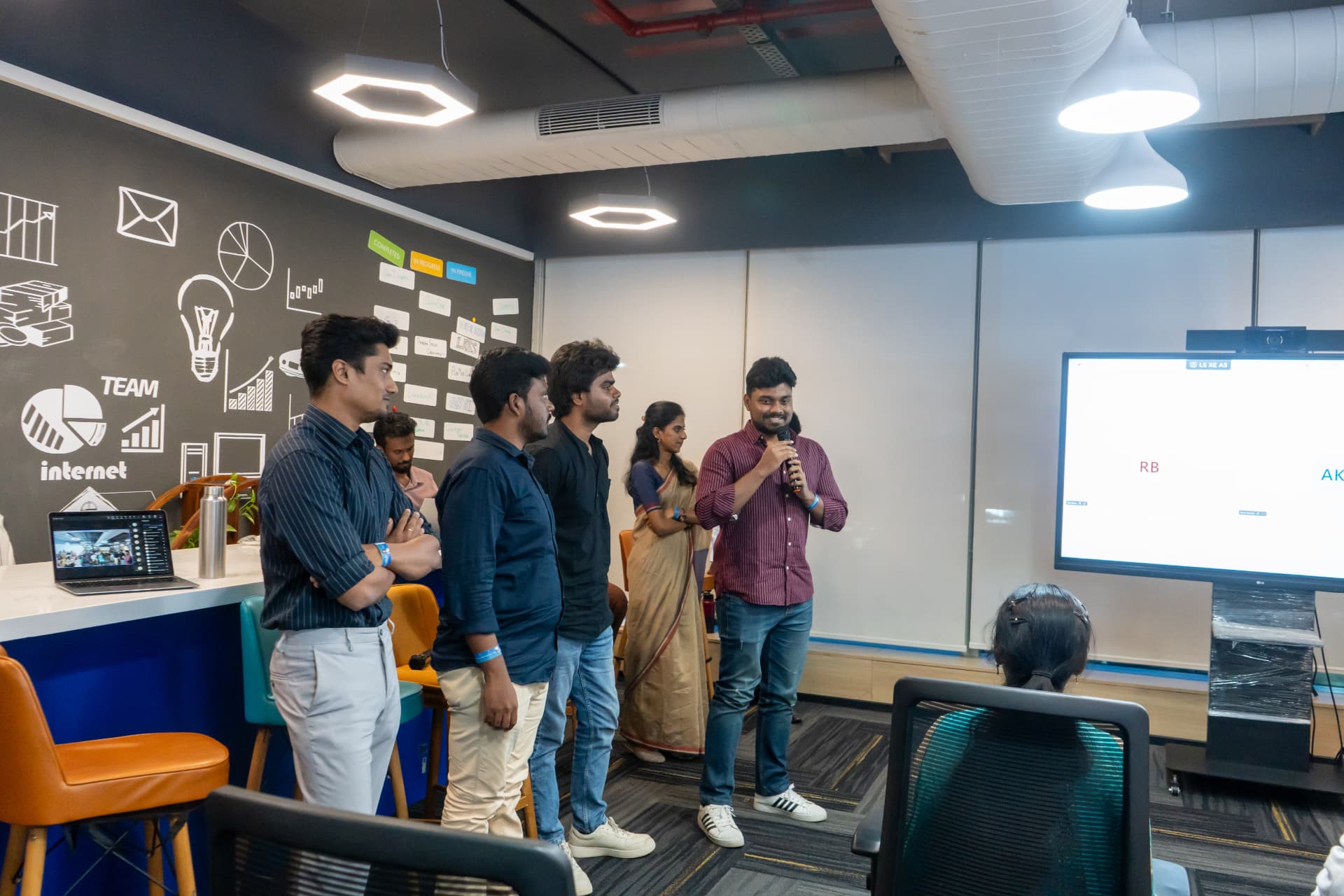 Team members presenting together during the Alexandria AI launch