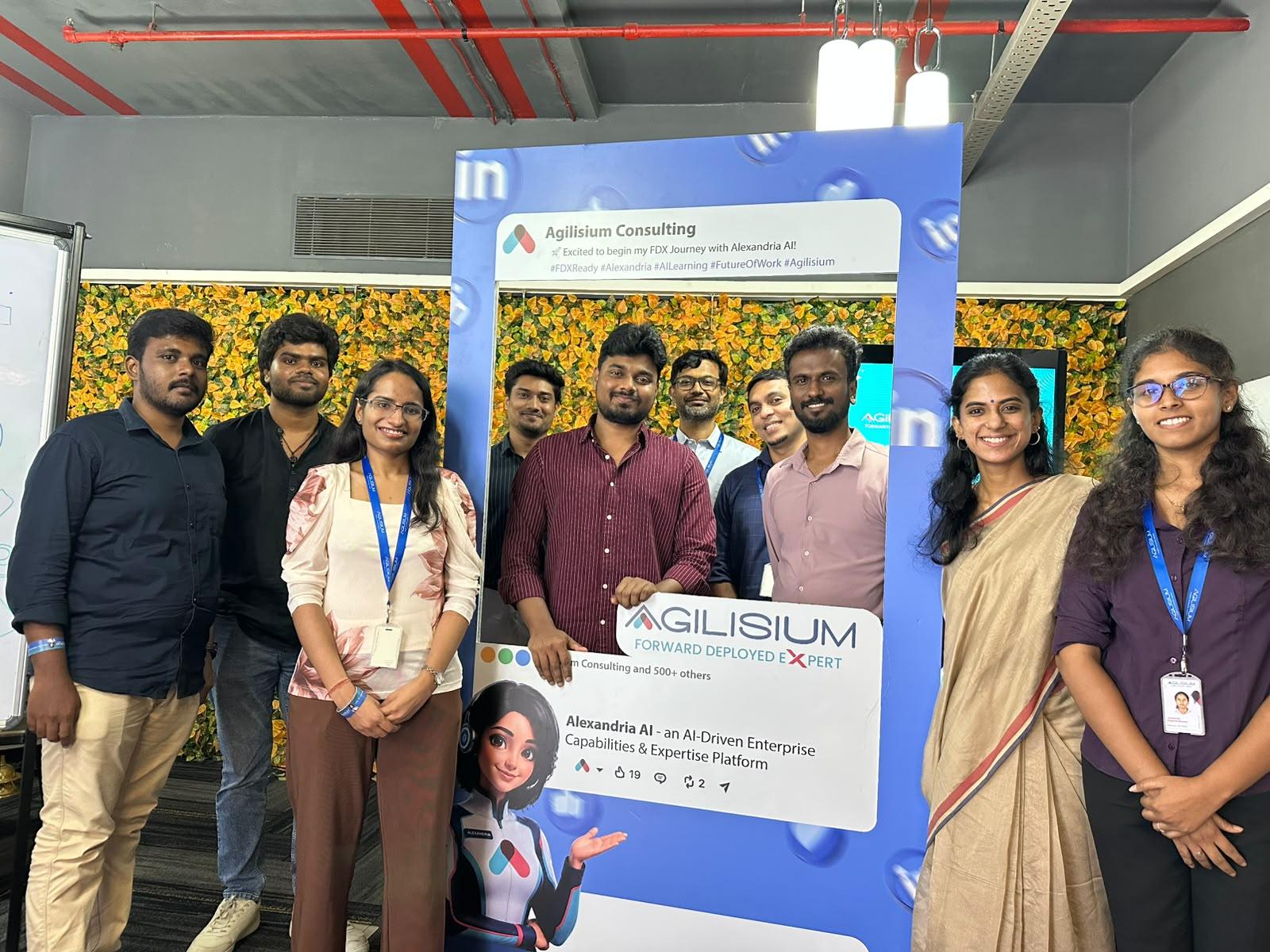 Team at the Alexandria AI launch beside the FDX journey standee