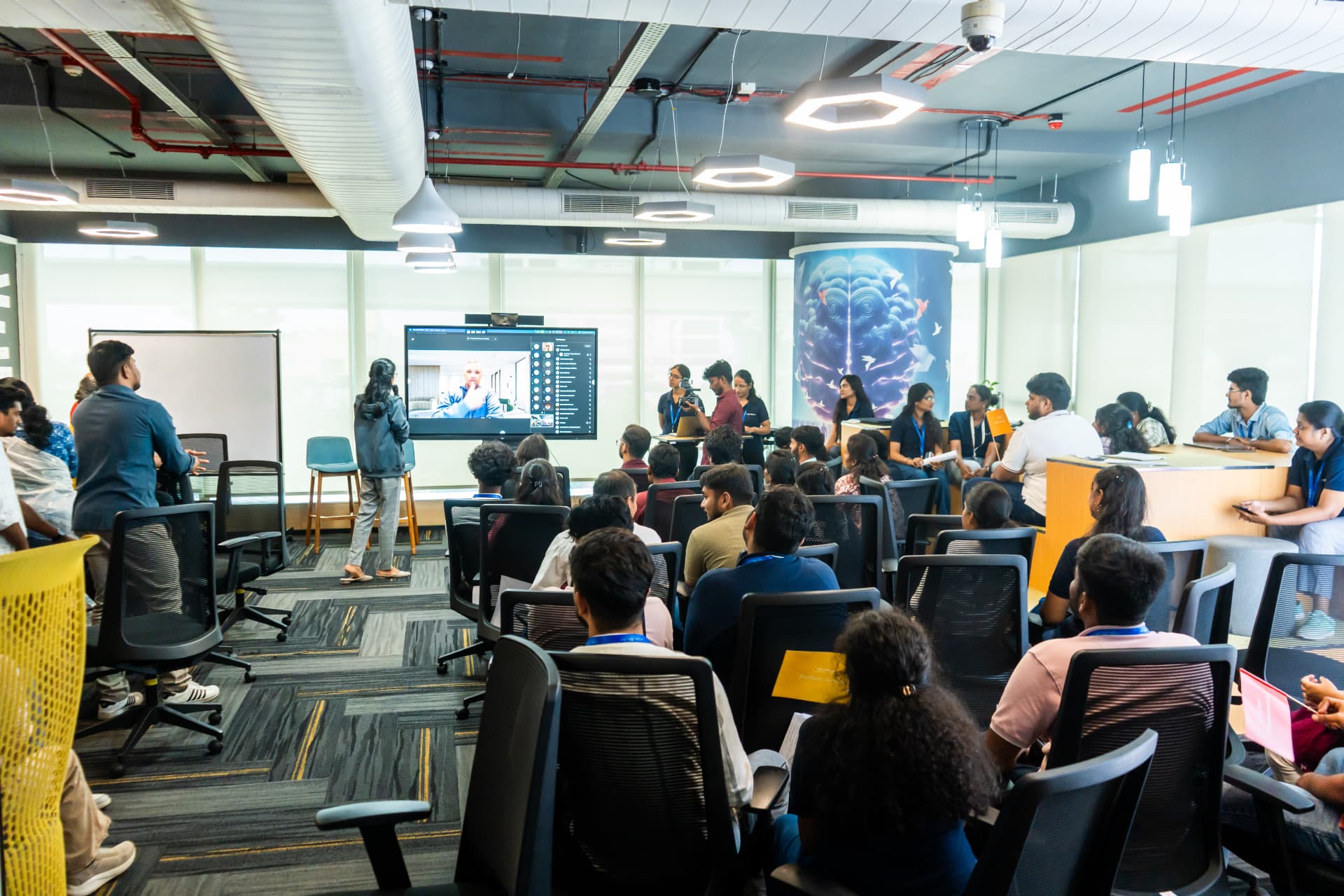 FDXe Sandhai session with colleagues watching a remote speaker on the display