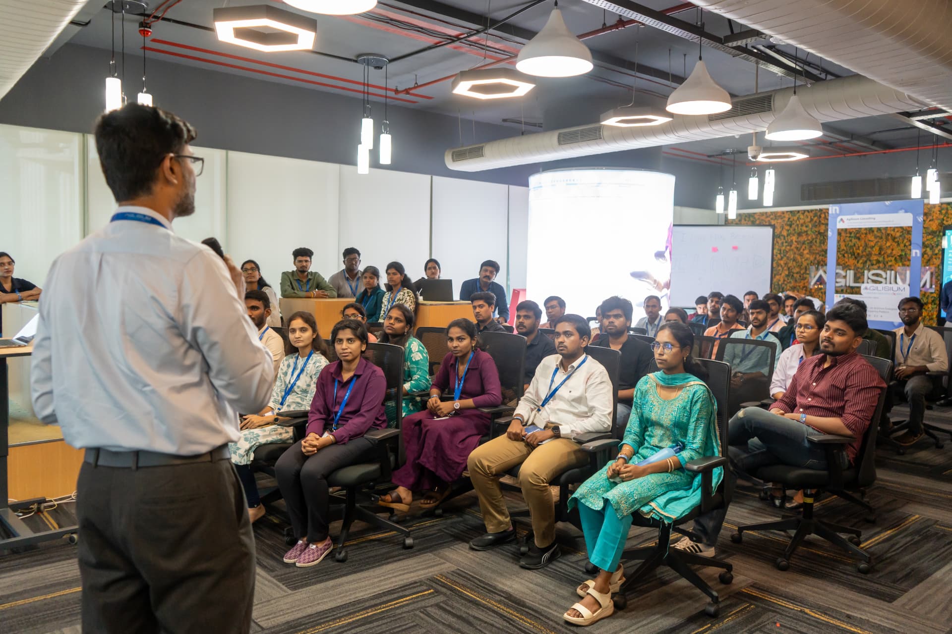 Full room of attendees listening to the opening address at the Alexandria AI launch